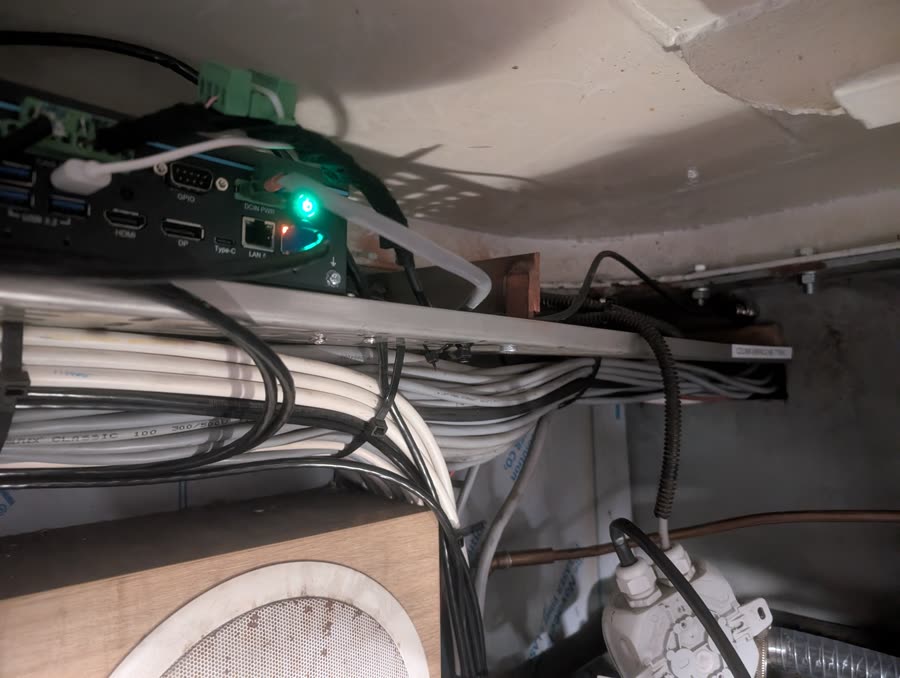 Advantech UNO-238 industrial box PC installed above cable runs, power LED lit, CAN terminal blocks connected